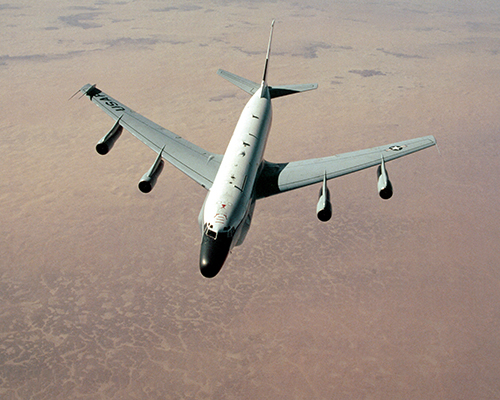 An image of a recon aircraft over desert